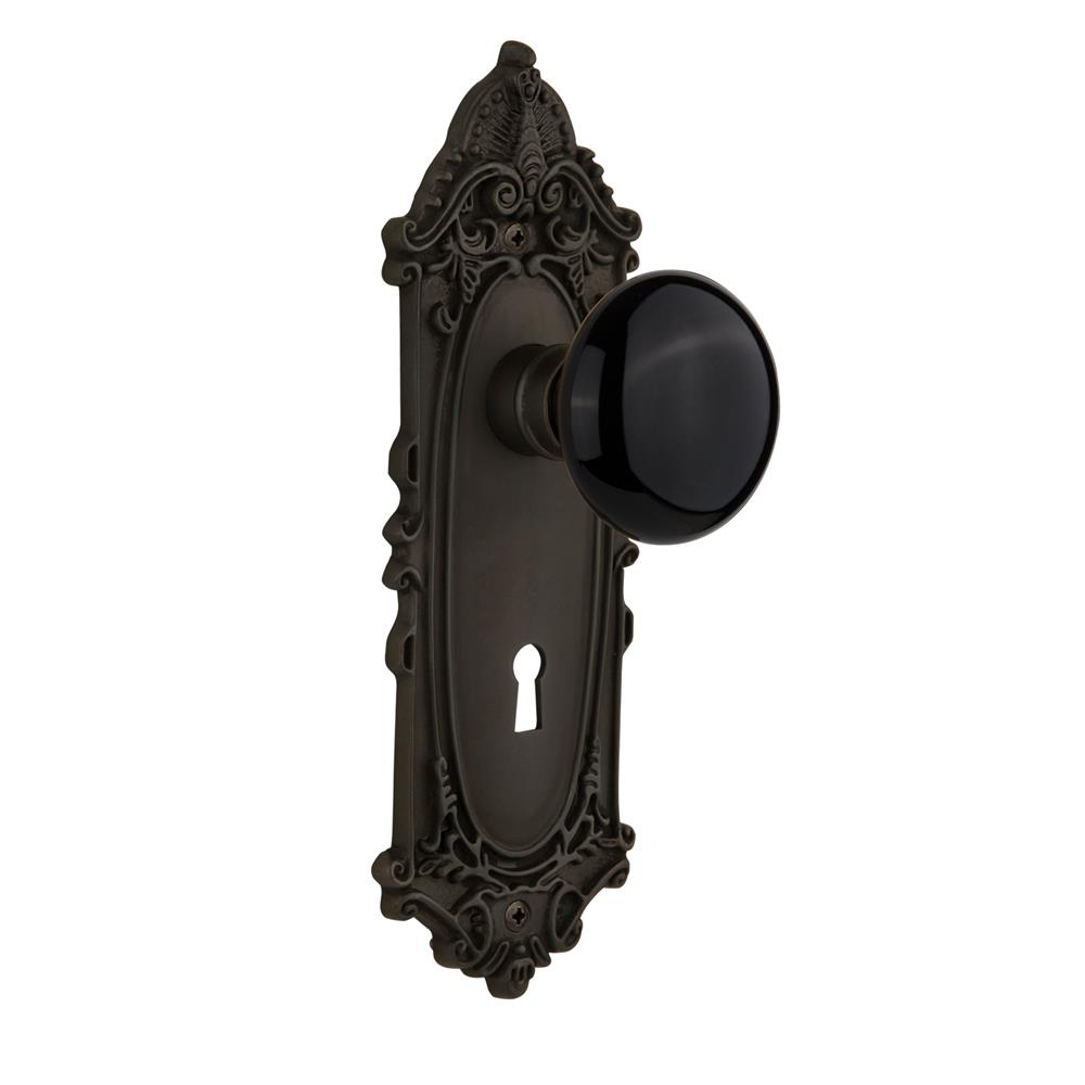 Nostalgic Warehouse VICBLK Passage Knob Victorian Plate with Black Porcelain Knob with Keyhole in Oil Rubbed Bronze